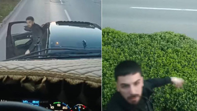 Trafikte şoförü ile tartıştığı kamyonu yumrukladı; o anlar kamerada